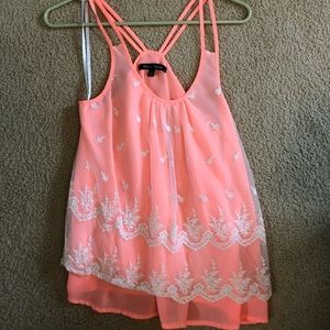 coral tank with lace embellishments